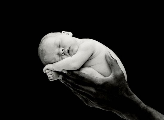 Baby On Black Hands