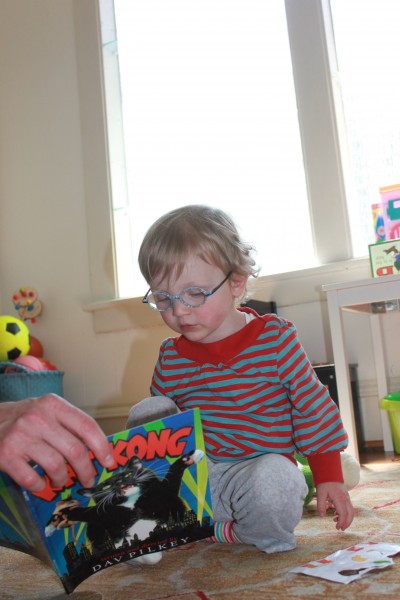 Baby With Cartoon Magazine