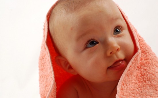 Baby With Orange Towel