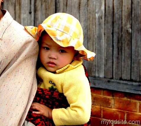 Baby With Yellow Cap