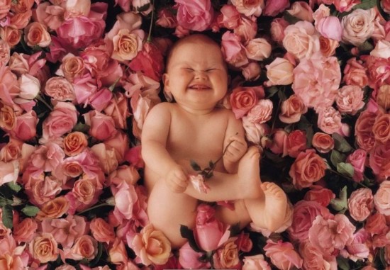 Smiling Baby With Flowers