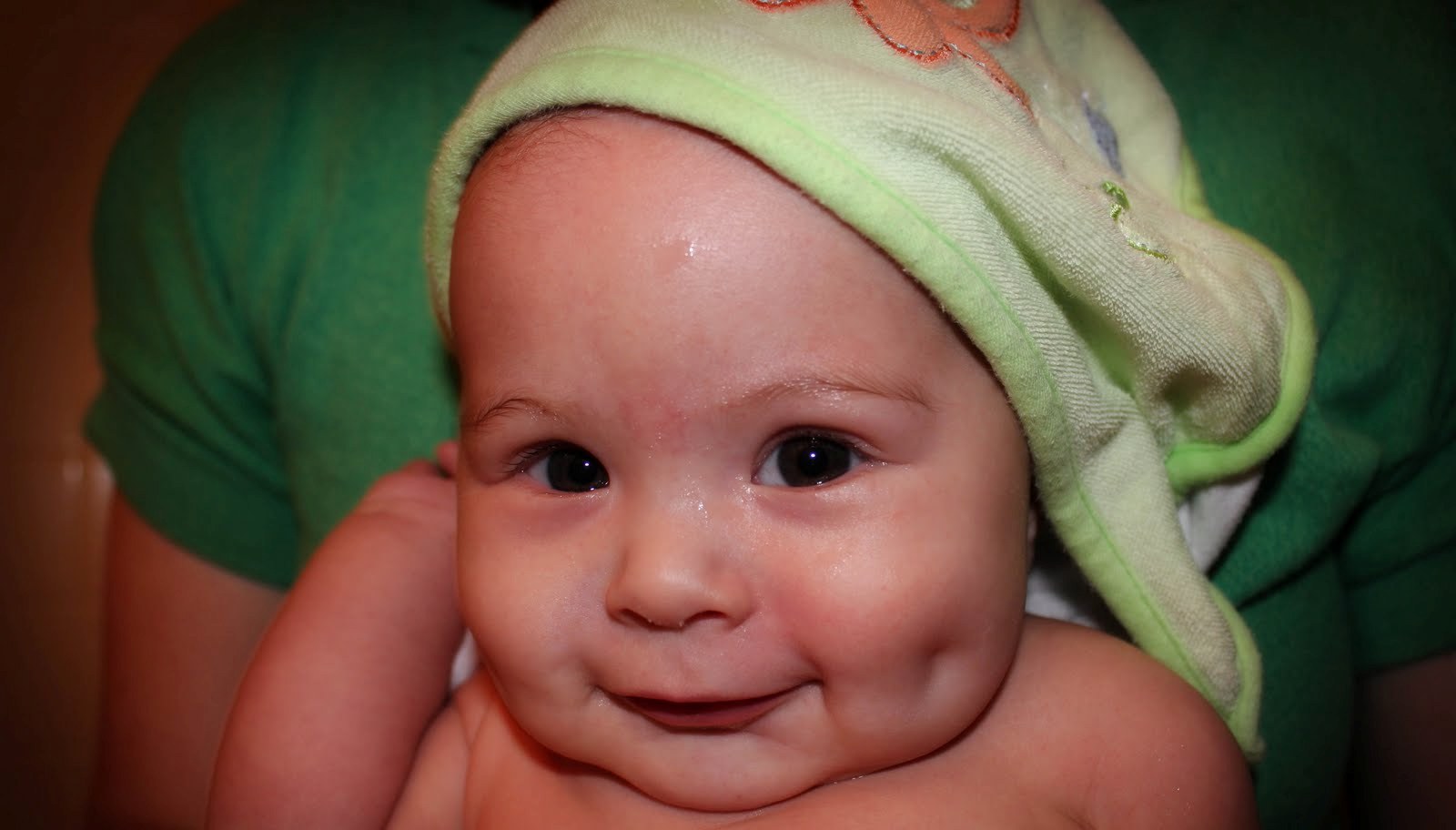 bathing dimpled baby