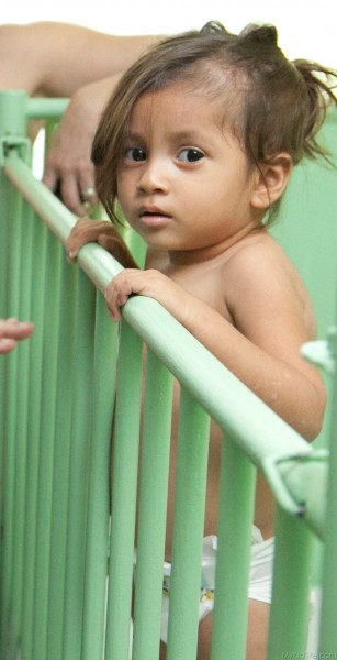 Baby Girl In Crib