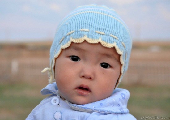 Baby Girl With Cap