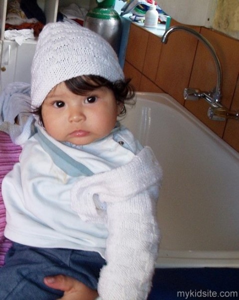 Baby With White Cap