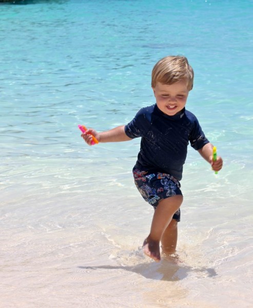 Running Baby On Beach