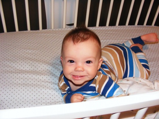 Smiling Baby In Crib