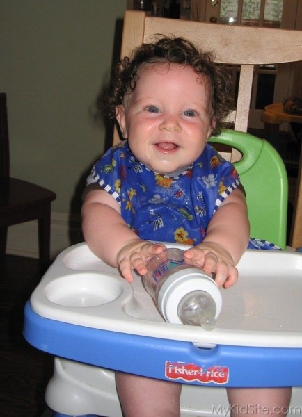 Smiling Baby With Bottle