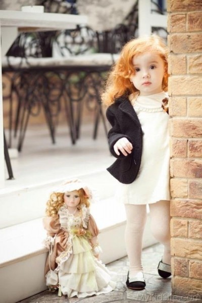 Sweet Girl With Doll