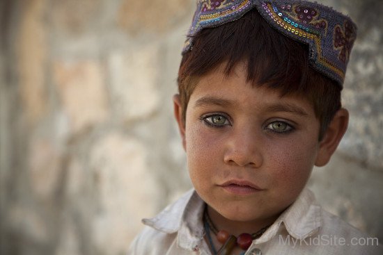 Afghani Baby Wearing Afghani Cap