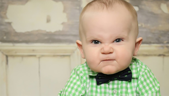 Angry Baby Boy In Green And White Check Shirt