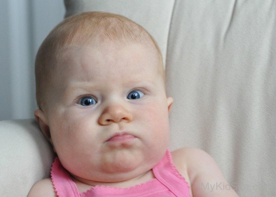 Angry Baby Girl In Pink Dress