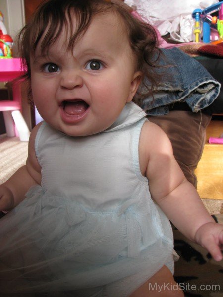 Angry Baby Girl In White Dress