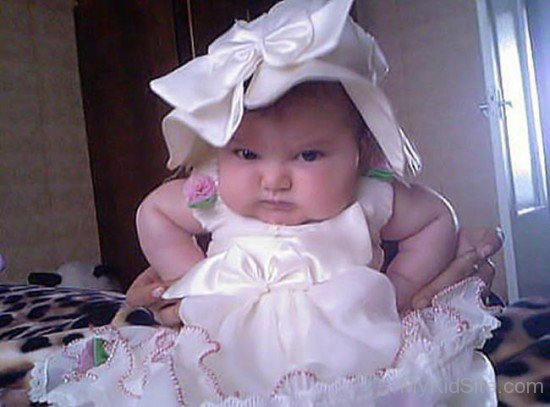 Angry Baby In White Dress
