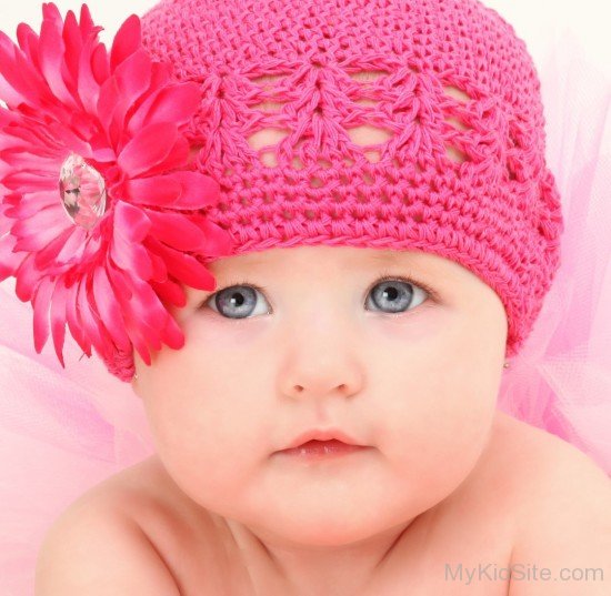 Cute American Baby Girl In Pink Woolen Cap