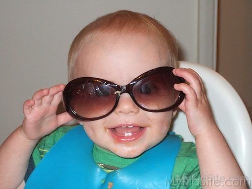 Smiling Baby With Glasses