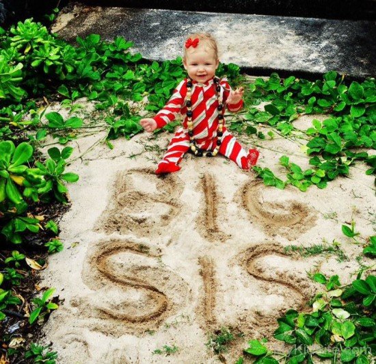 Baby Enjoying In Garden