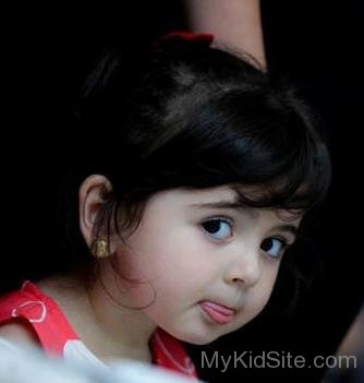Baby Girl Showing Tongue