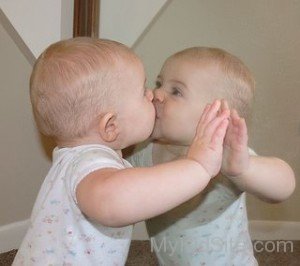 Baby Kissing Self In Miror