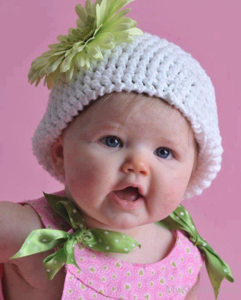 Baby Wearing White Cap