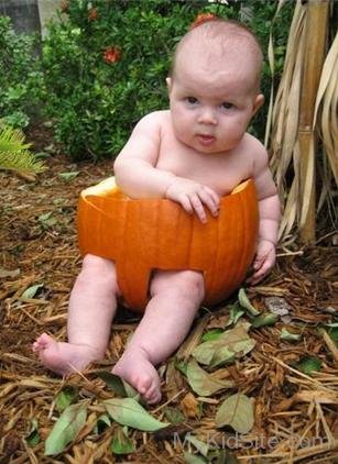 Funny Baby in Pumpkin