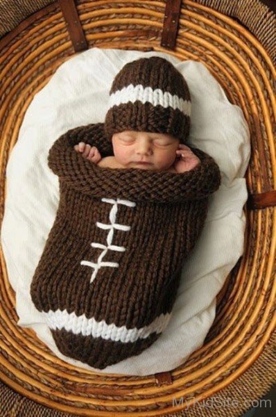 Cute Baby Boy Sleeping In Basket