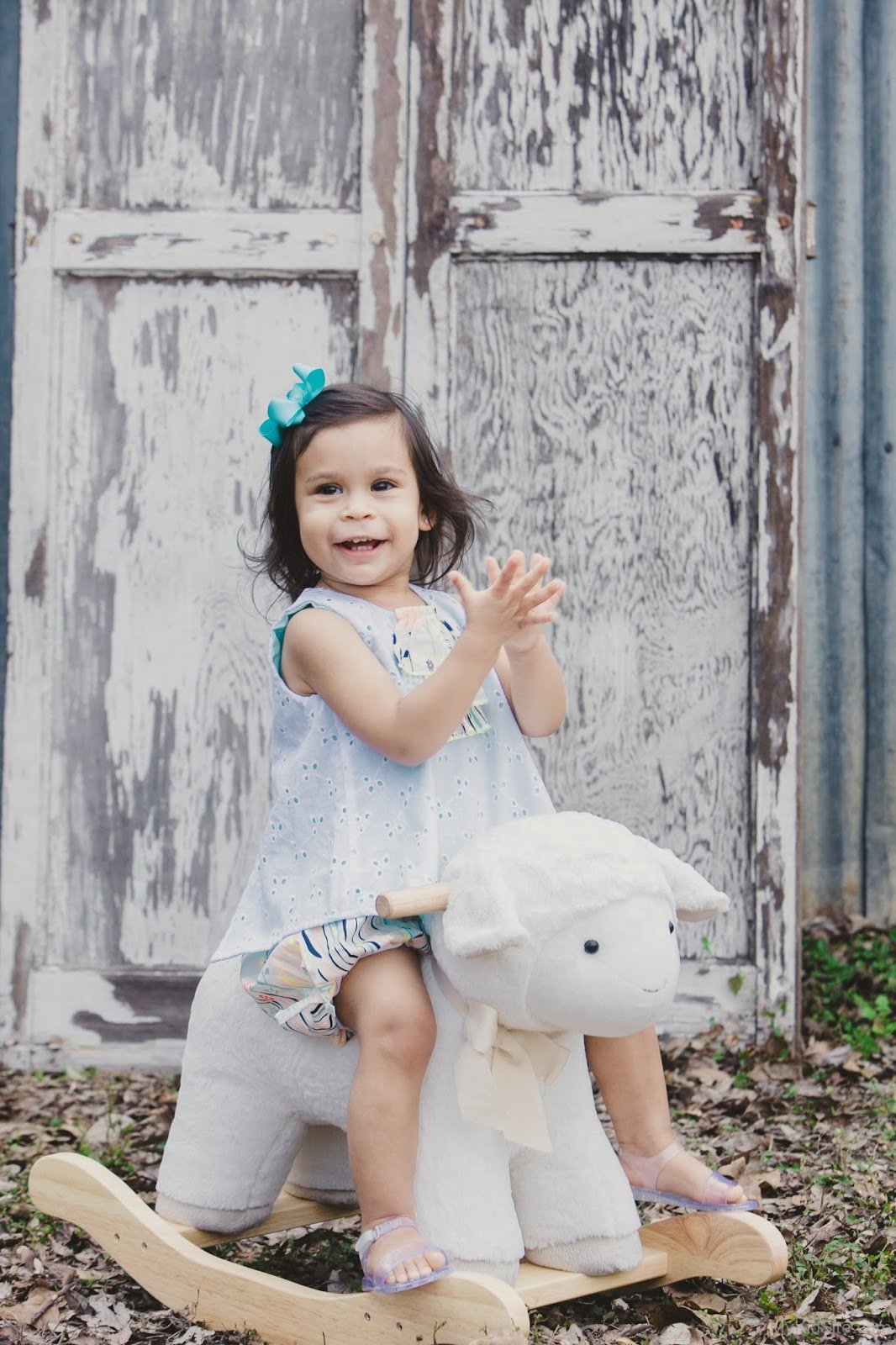 Cute Baby Girl On Toy Horse