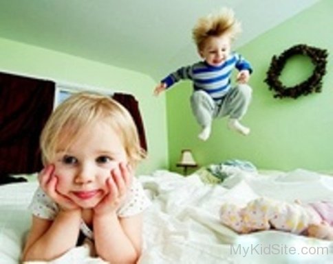 Cute Baby Jumping On Bed