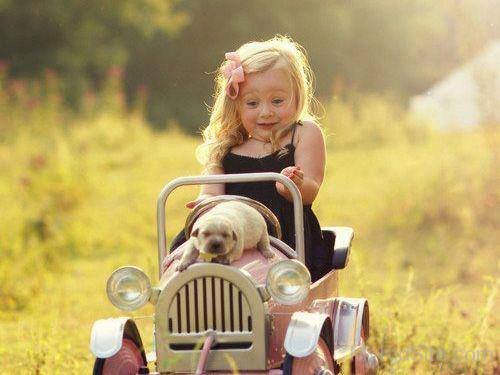 Cute Baby On Toy Car