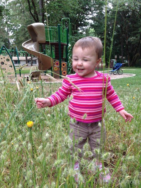 Cute Baby Playing In Garden