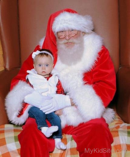 Cute Baby With Santa Claus