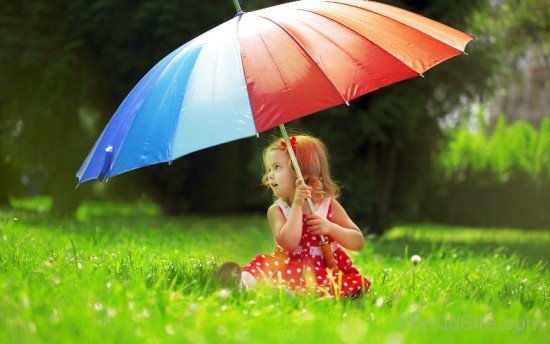 Baby Girl Playing In Rain Under Umbrella