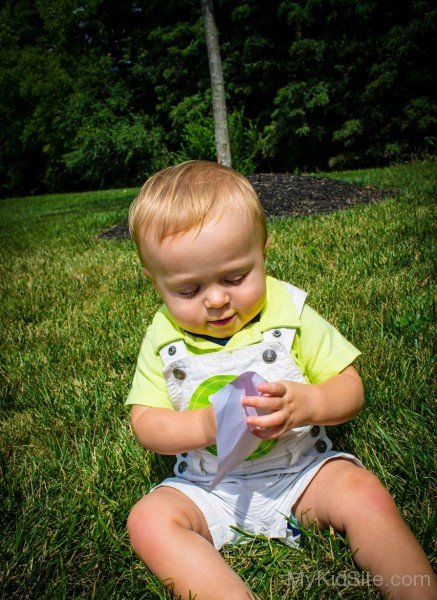 Baby Holding Paper