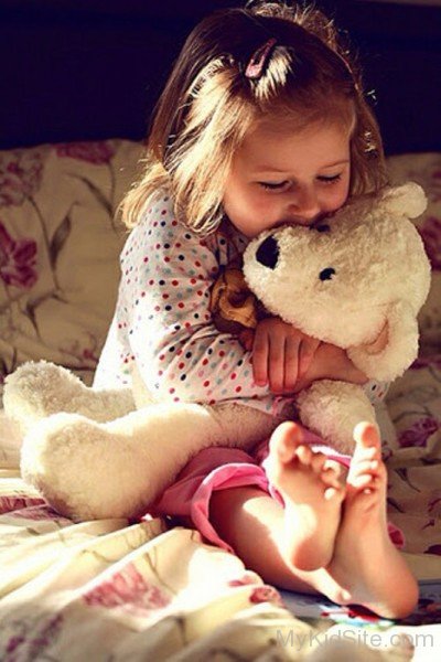 Baby Holding Teddy