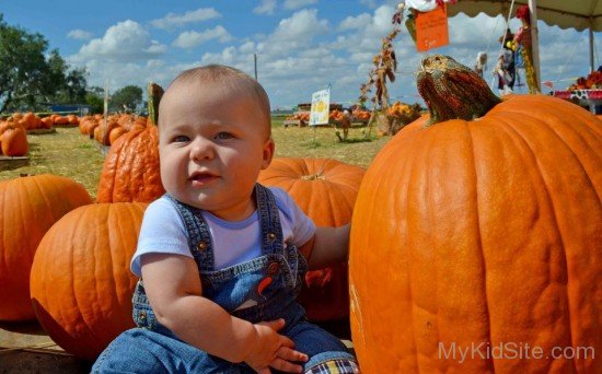 Baby With Pumpkins