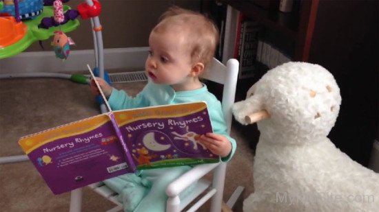 Cute Baby Girl Reading Book