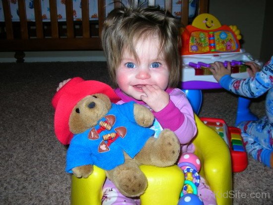 Cute Baby Girl Holding Teddy