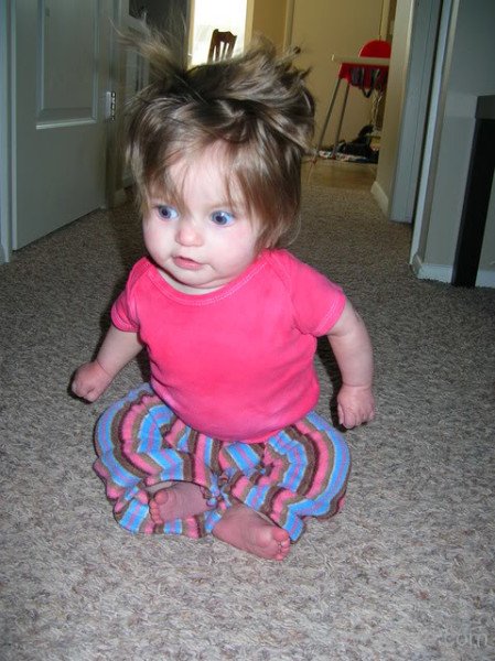 Cute Baby Girl On Floor