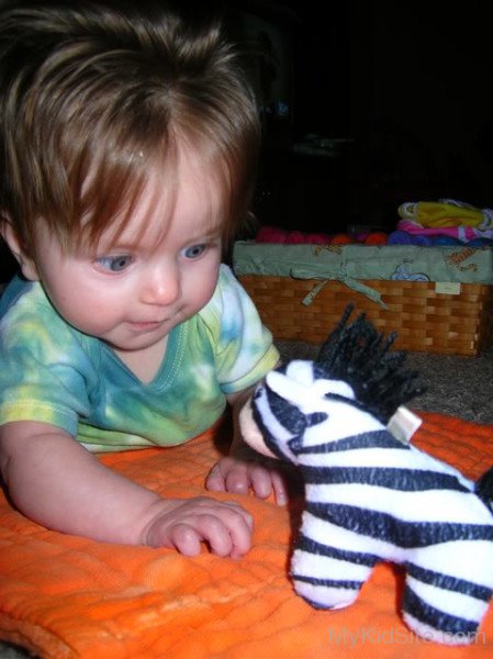 Cute Baby Girl Playing With Toy