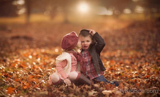 Cute Baby Girl And Boy Kissing