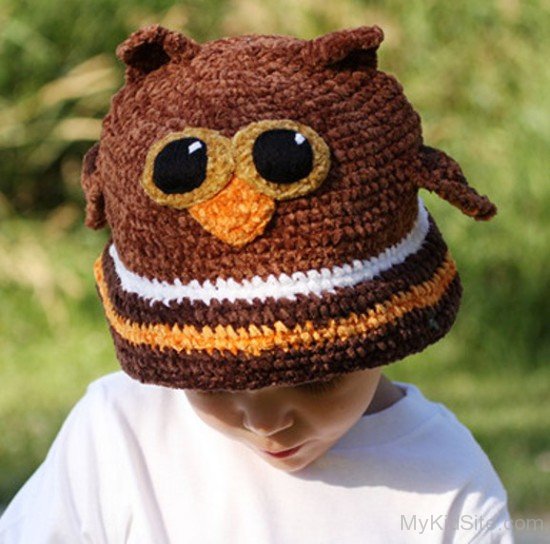 Cute Baby In Brown Owl Hat
