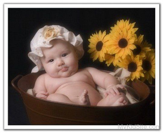 Baby In Flowers