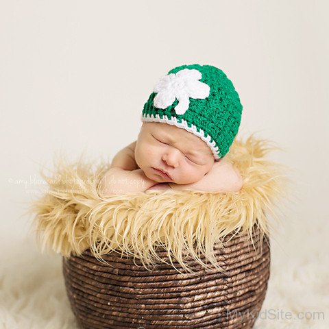 Cute Baby In Green Crochet Cap