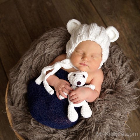 Cute Baby Holding  Teddy Bear