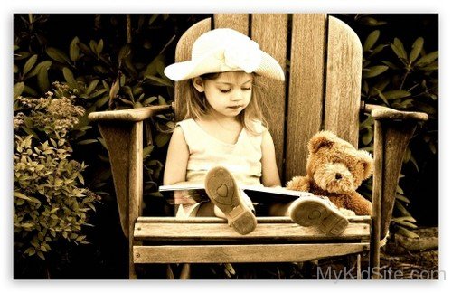 Cute Baby On Chair With Teddy