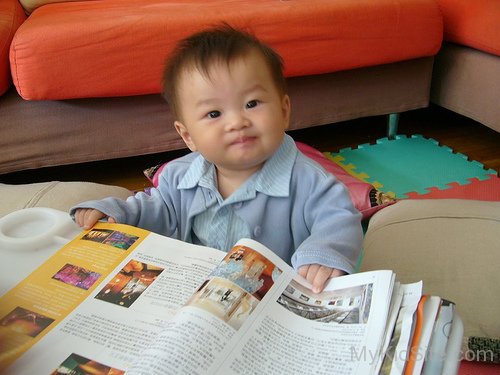 Baby Boy Holding Book