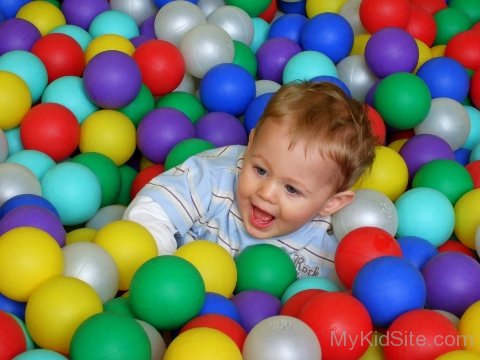 Cute Baby Playing With Ball Image