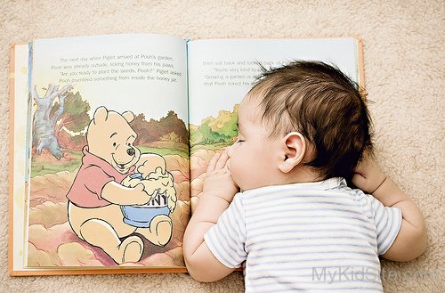 Cute Baby Sleeping  On Book