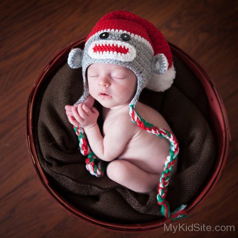 Cute Baby Sleeping In Basket Image
