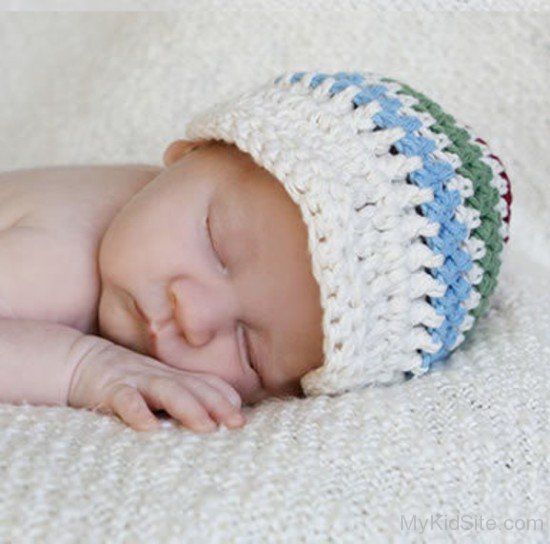 Cute Baby Wearing White Cap